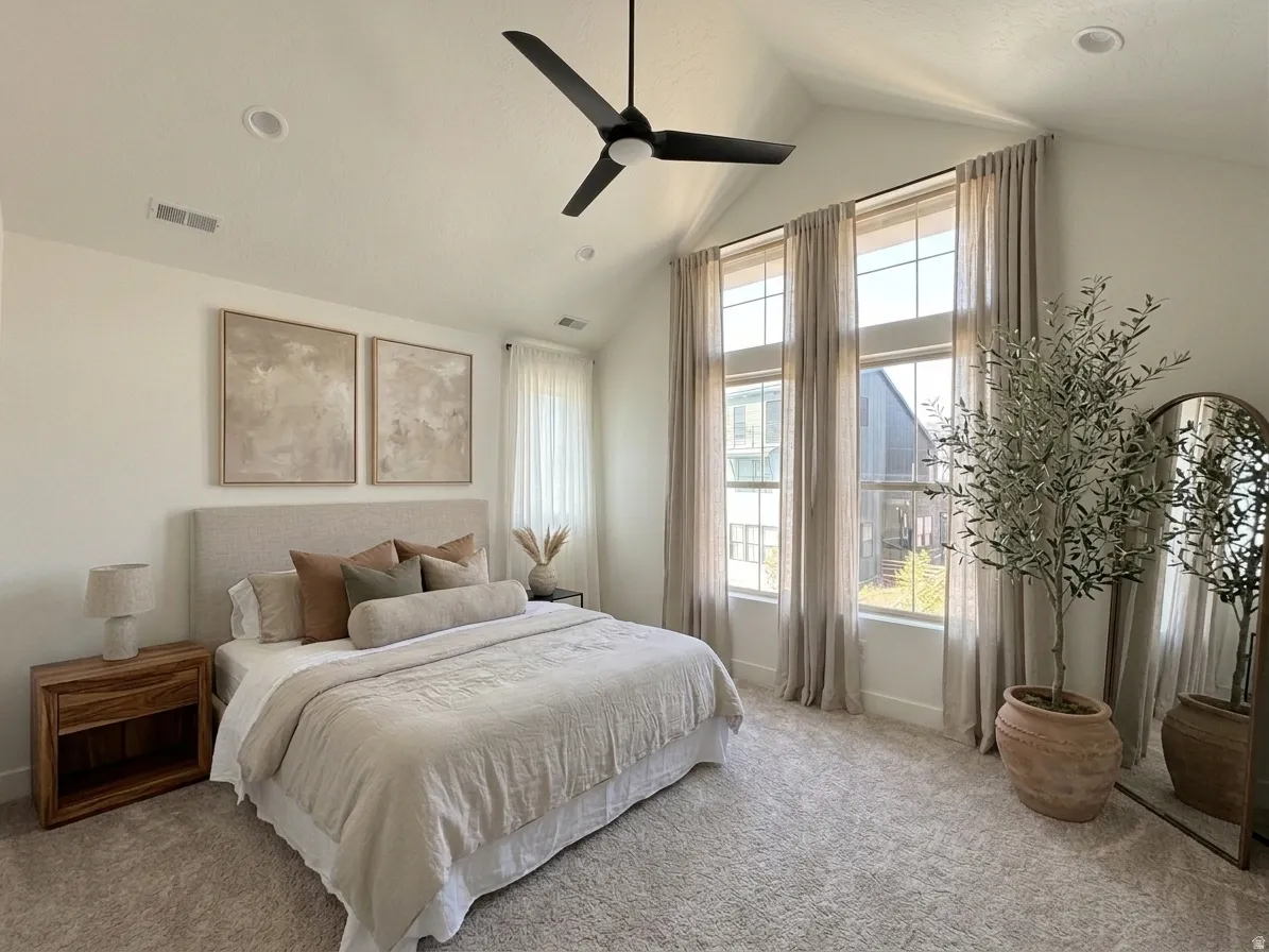 Owner's Suite featuring expansive windows and vaulted ceilings
