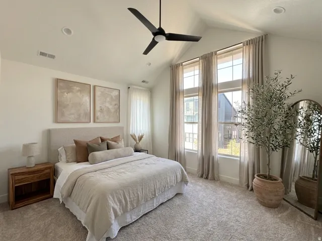 Owner's Suite featuring expansive windows and vaulted ceilings