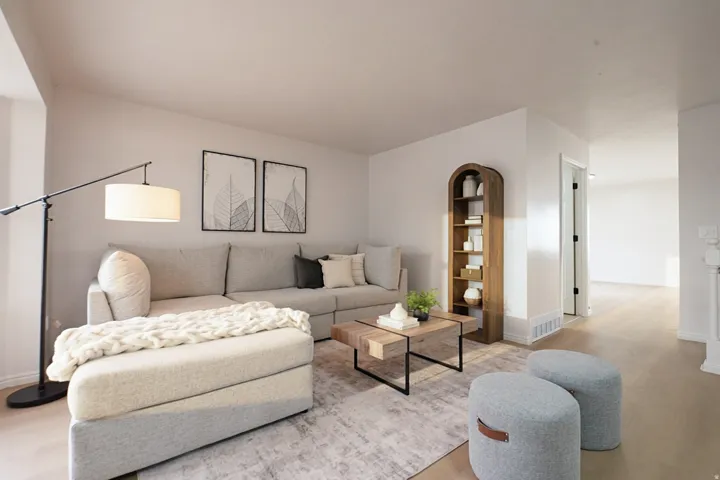 Neutral wall paint, wood-finish flooring, and a built-in arched wooden bookshelf