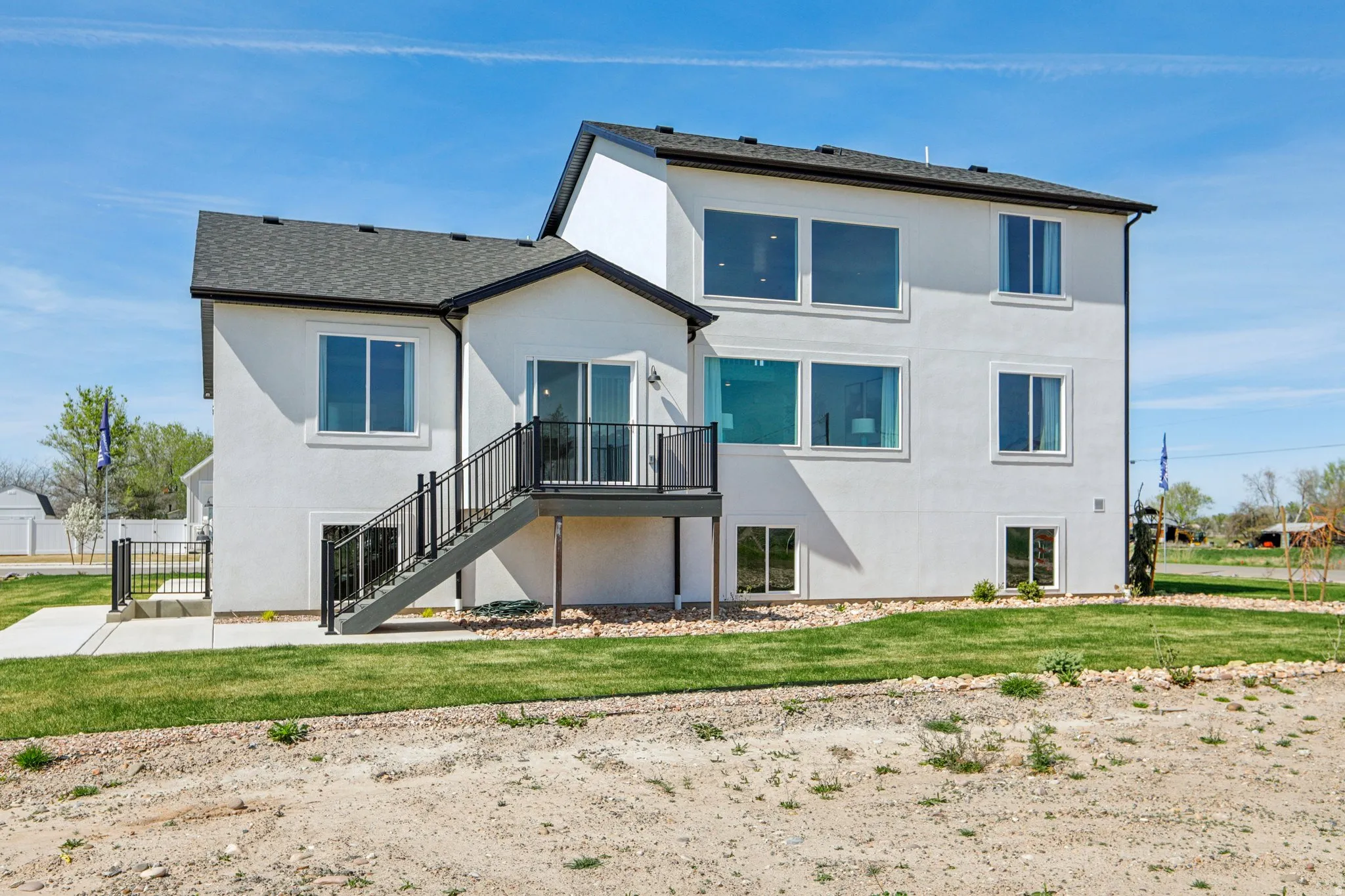 White stucco exterior with a multi-level design