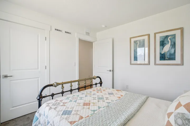 White interior doors with brushed nickel hardware, recessed ceiling lighting, and light-colored wall paint
