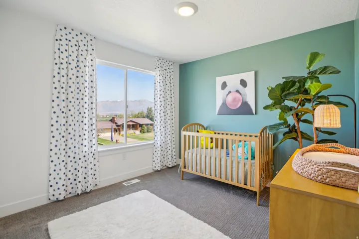 Recessed ceiling light, expansive window, carpeted flooring, and a painted accent wall