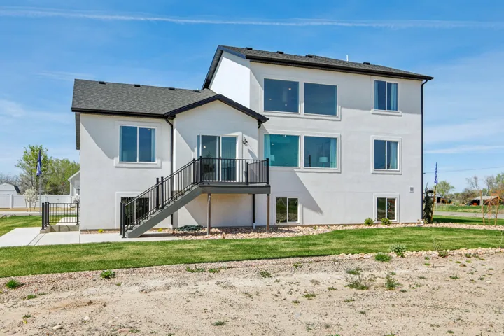 White stucco exterior with a multi-level design