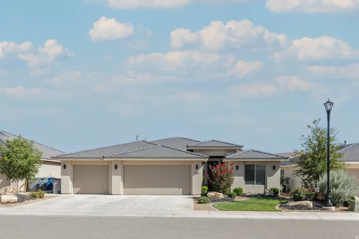 Contemporary stucco exterior with a gray tile roof