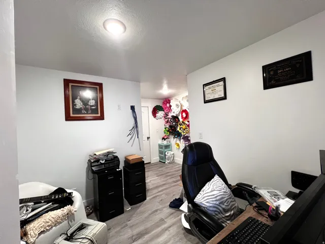 Additional cThis basement office is part of the main home. The door in the back of the photo leads to the cold storage.