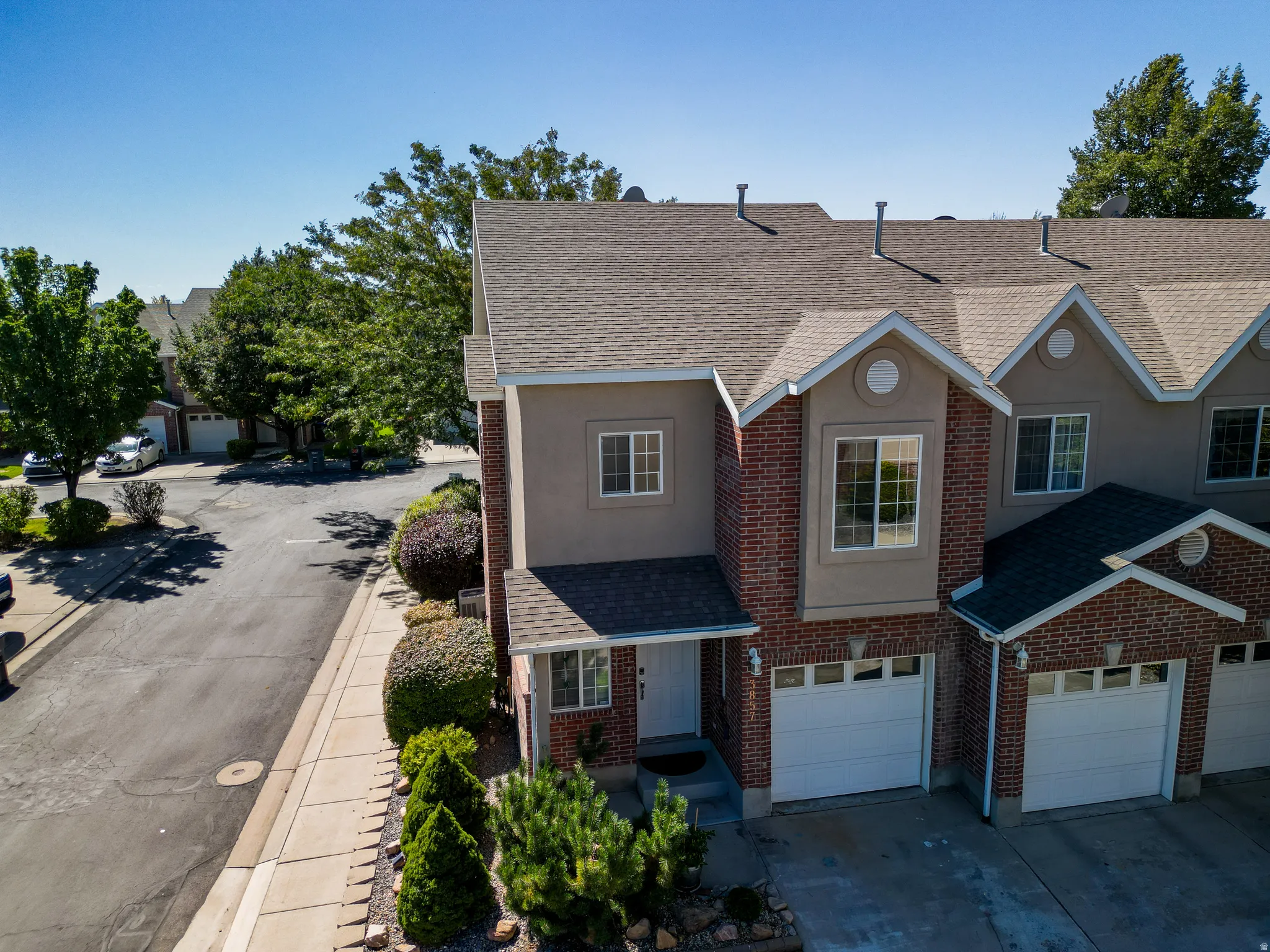 Brick and stucco exterior with multiple gabled rooflines