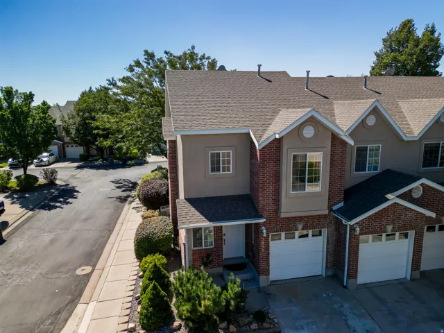 Brick and stucco exterior with multiple gabled rooflines