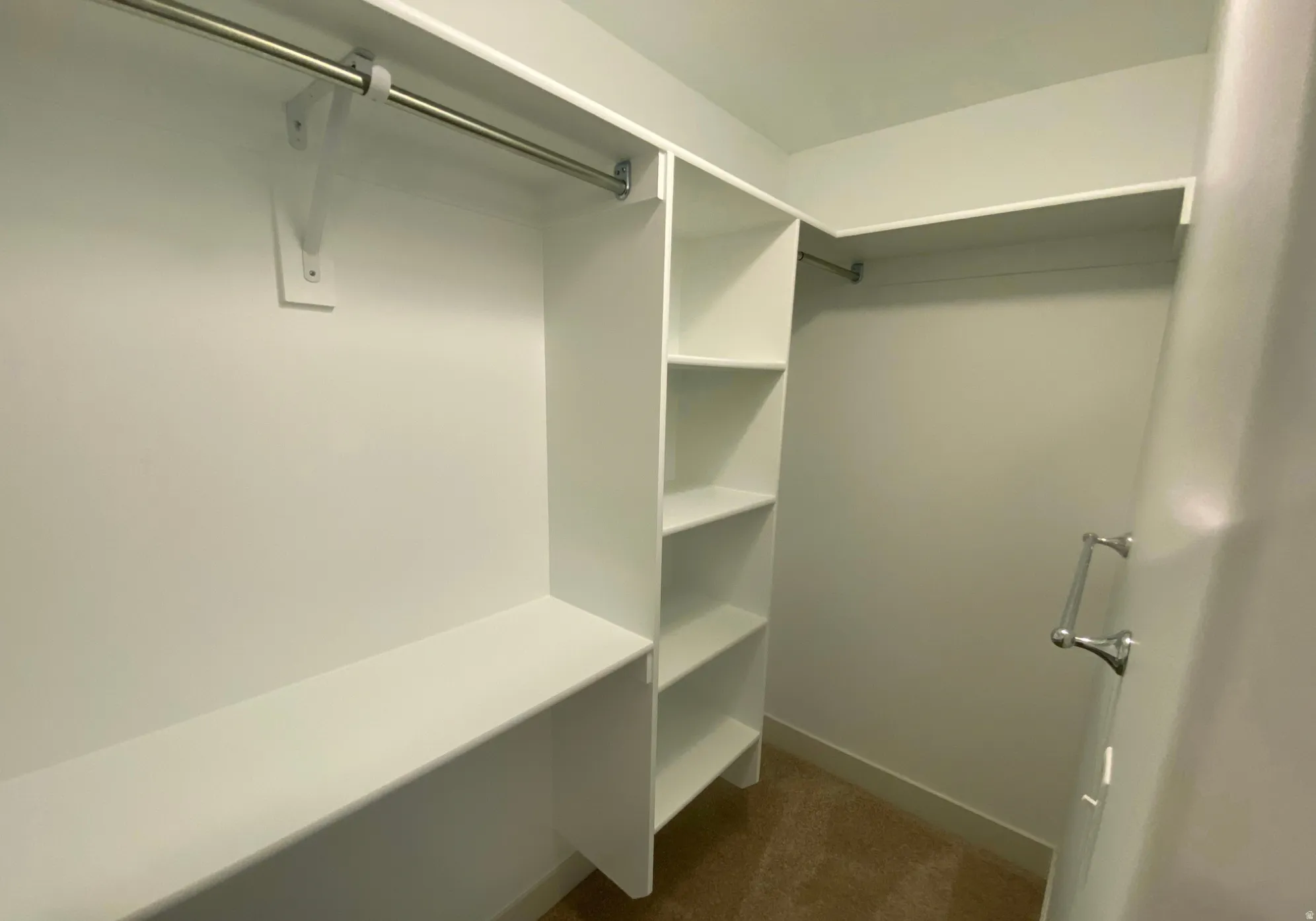 Built-in shelving, hanging rods, and integrated storage system