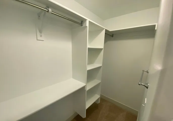Built-in shelving, hanging rods, and integrated storage system