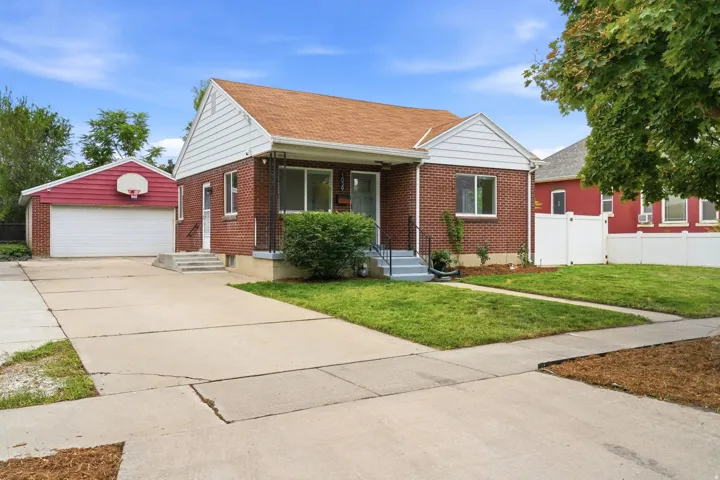 Brick home with oversized detached garage.