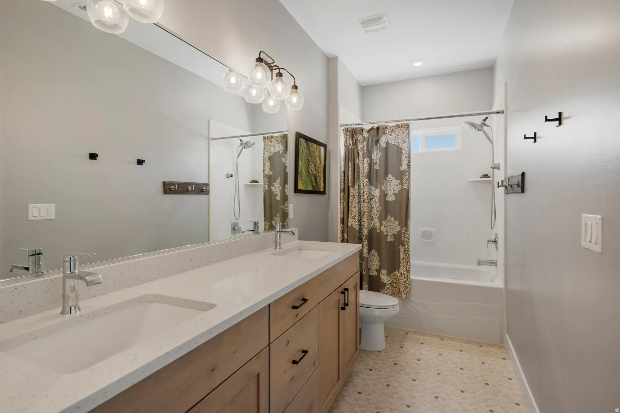 Dual vanity with integrated sinks and chrome fixtures