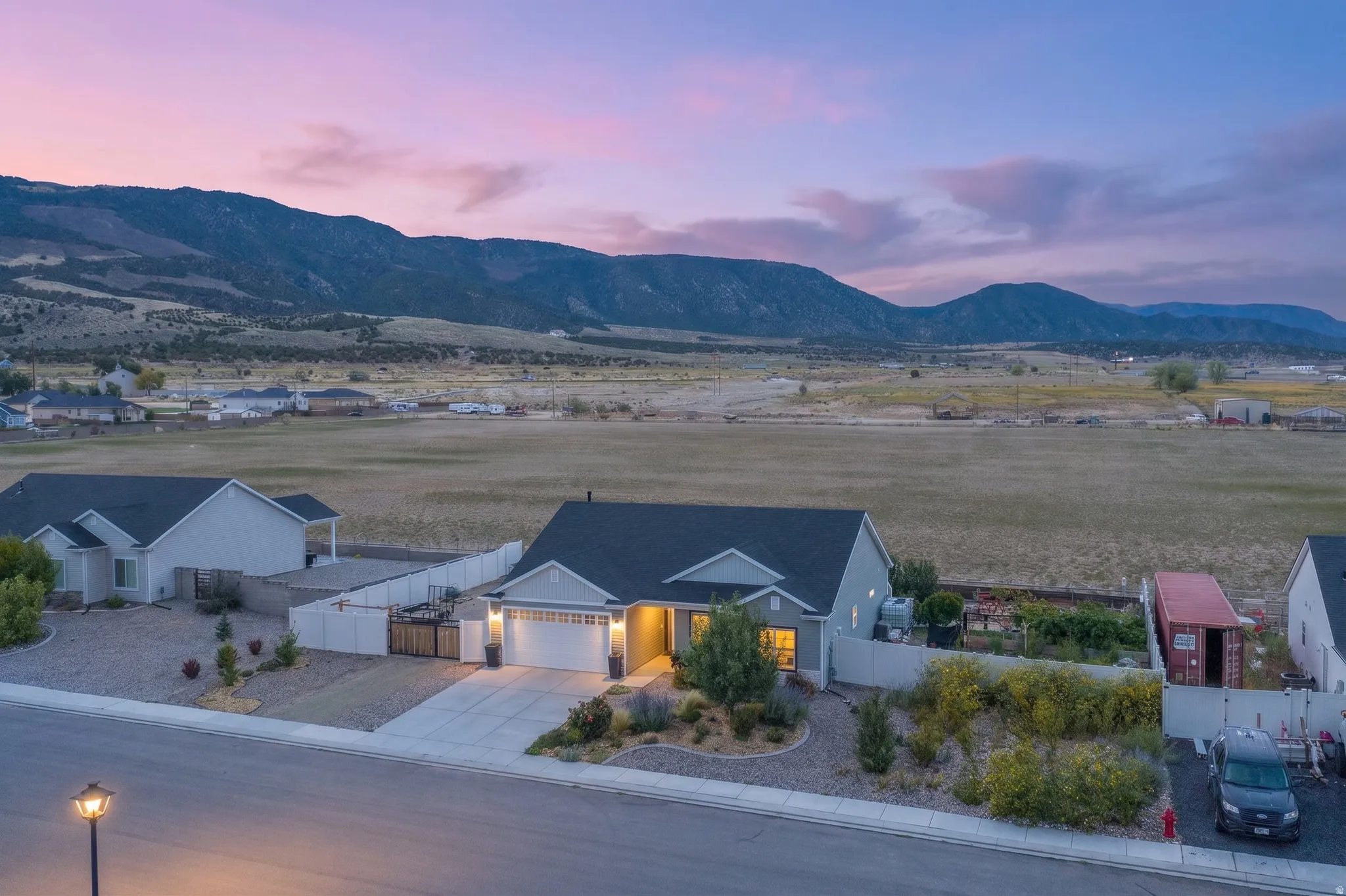 Single-story residence with an attached two-car garage, concrete driveway, and front landscaping