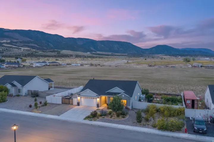 Single-story residence with an attached two-car garage, concrete driveway, and front landscaping