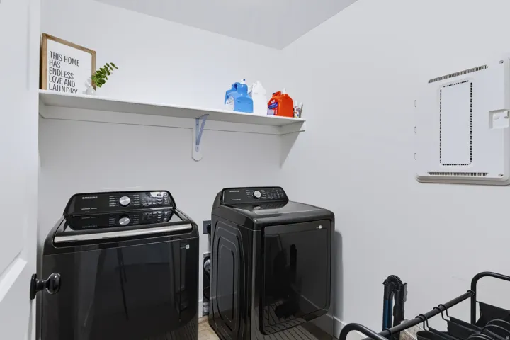 Wall-mounted shelving with support brackets provides storage