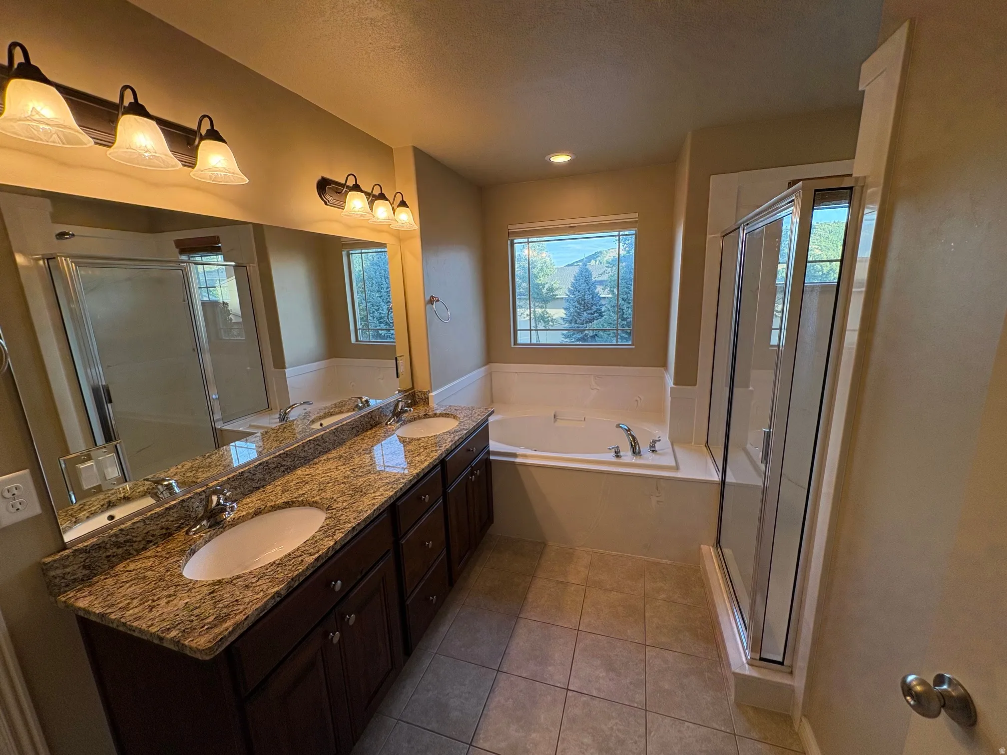 Dual vanity with granite countertop and undermount sinks