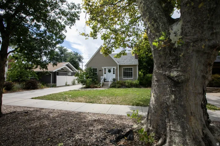 Siding exterior with a covered porch and white columns