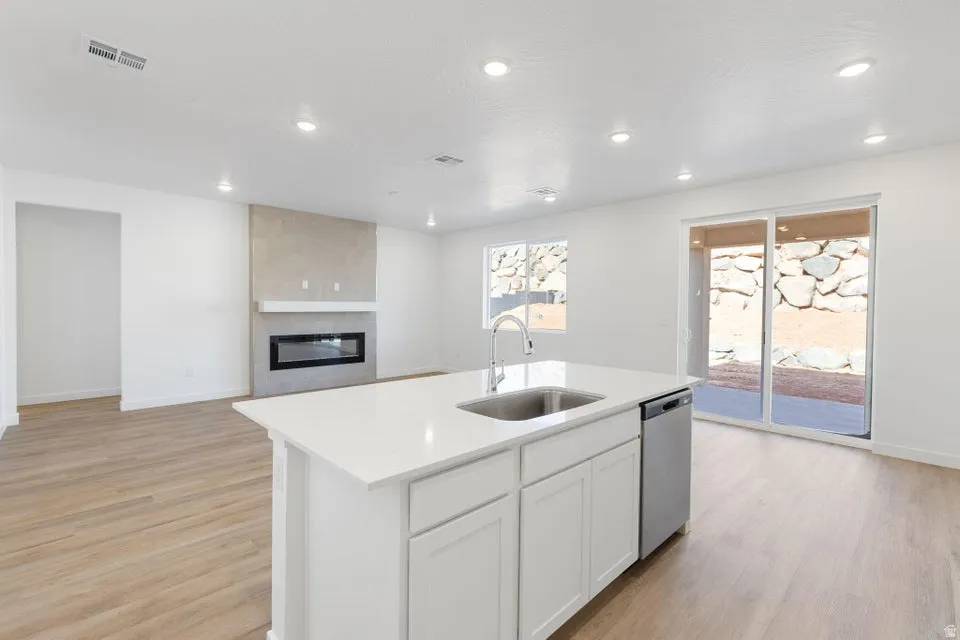 Open-concept living area with wood-finish flooring