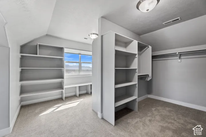 Built-in shelving, integrated desk space, and hanging rods