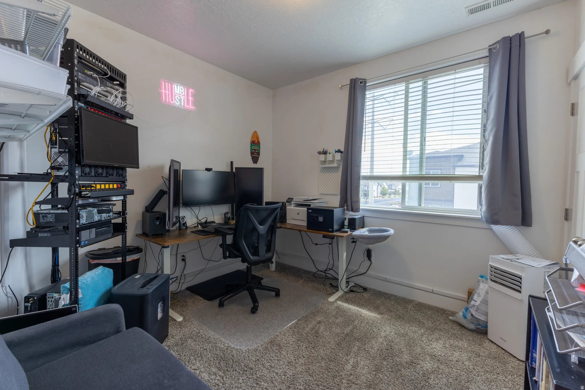 Window with white blinds and gray curtains