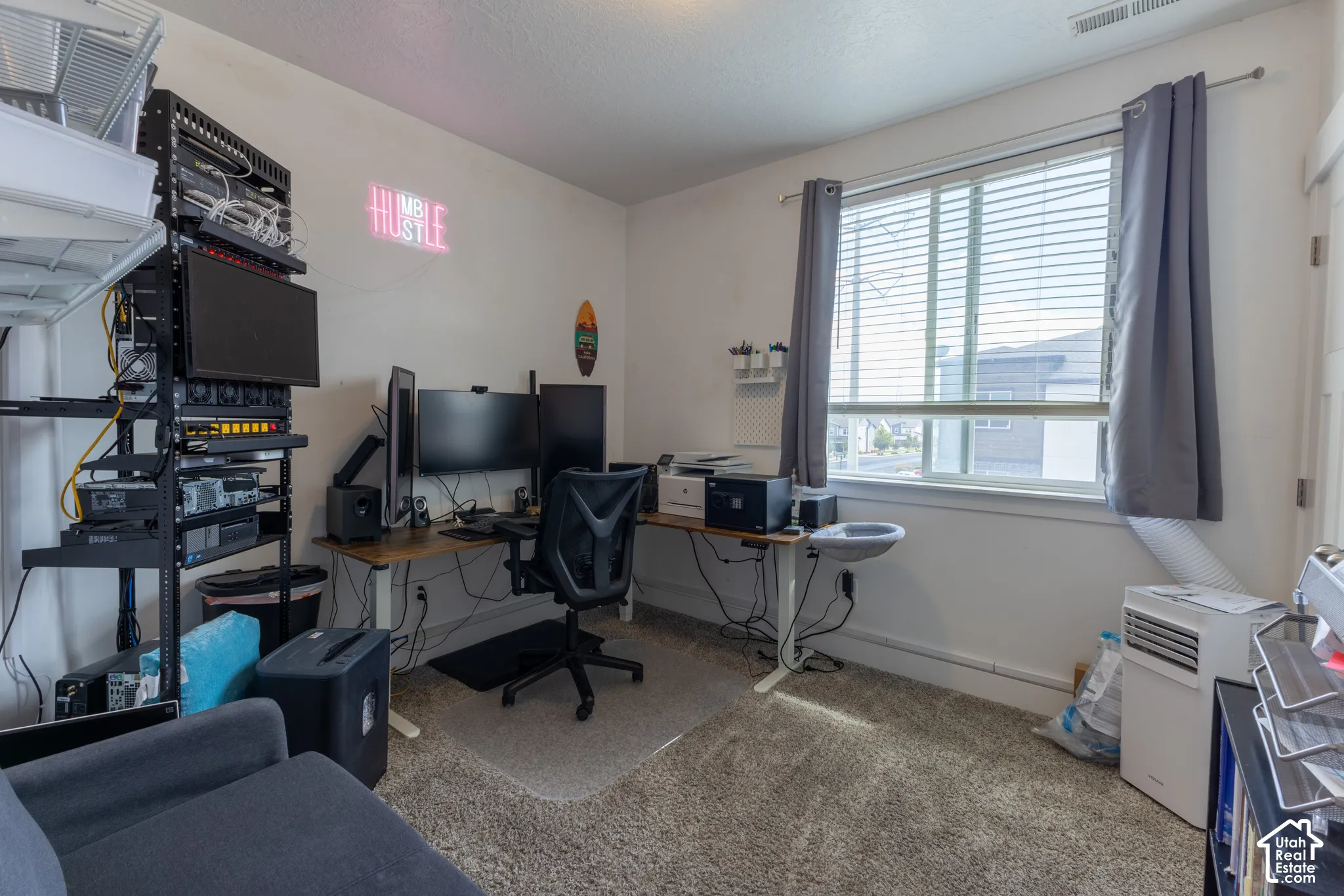 Window with white blinds and gray curtains