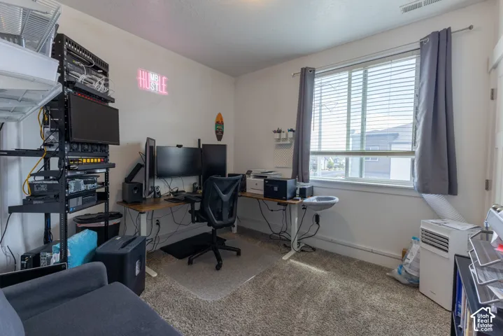 Window with white blinds and gray curtains