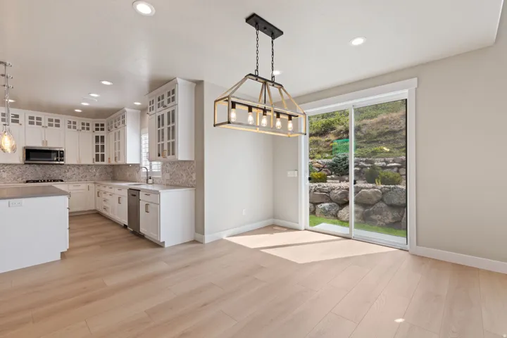 Open-concept living area with wood-finish flooring