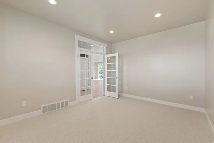 Neutral paint palette with recessed lighting and crown molding