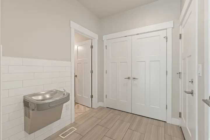 Light gray wall paint with white trim