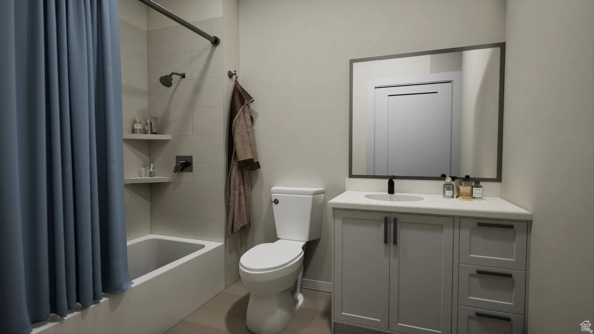 Bathroom featuring a vanity with a white countertop, an undermount sink, and a rectangular mirror