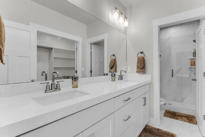 Dual vanity with integrated sinks and chrome fixtures