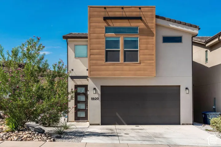 Modern exterior with wood-finish paneling and stucco siding