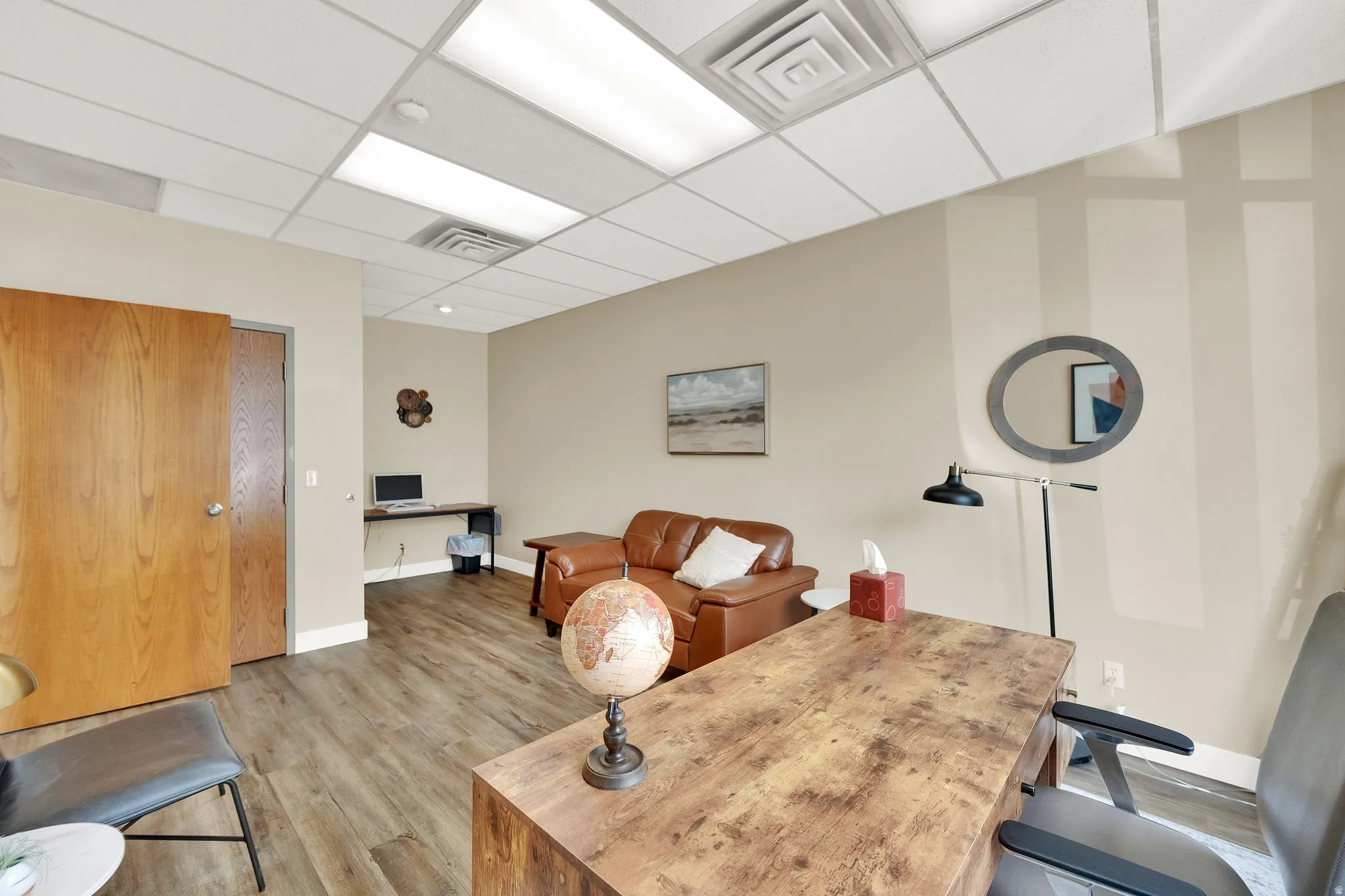 Neutral-toned walls complement wood-finish flooring