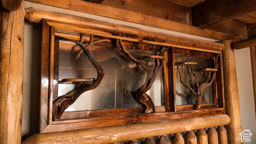Window featuring custom wood-carved details and integrated shelving
