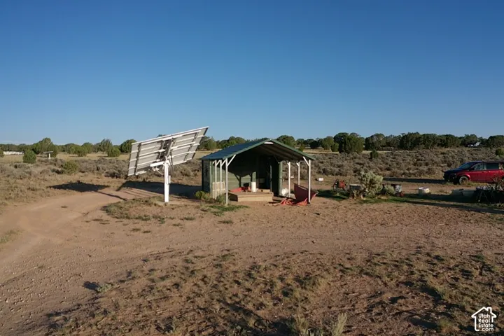 Solar panel array, covered structure, and expansive natural landscape