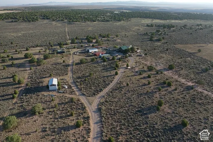 Extensive natural landscape with multiple structures and established pathways
