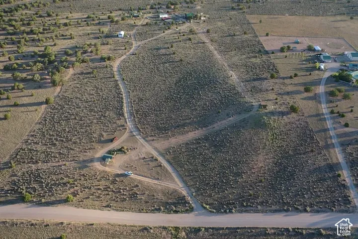 Expansive undeveloped land featuring natural desert landscaping and unpaved access roads