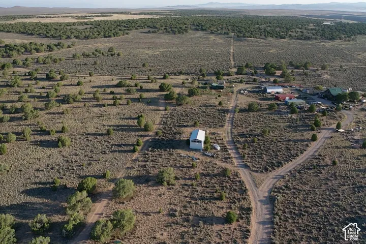 Expansive desert landscape featuring natural vegetation and multiple structures