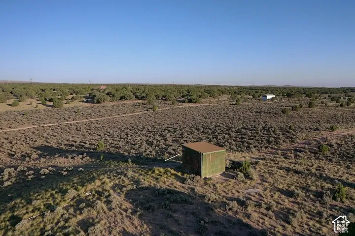 Expansive arid landscape with scattered low-lying vegetation