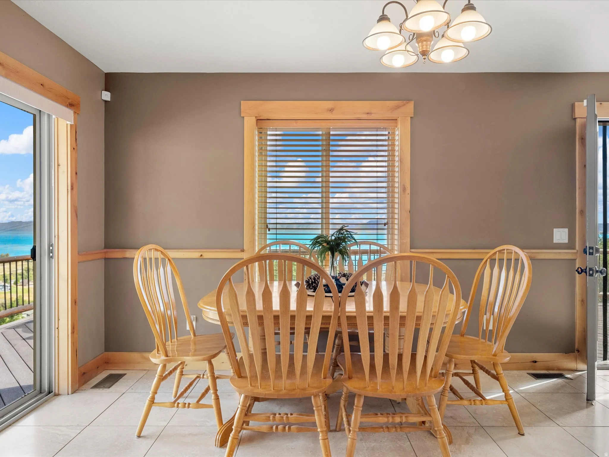 Terracotta tile flooring with a neutral wall color, accented by wood trim and window frames