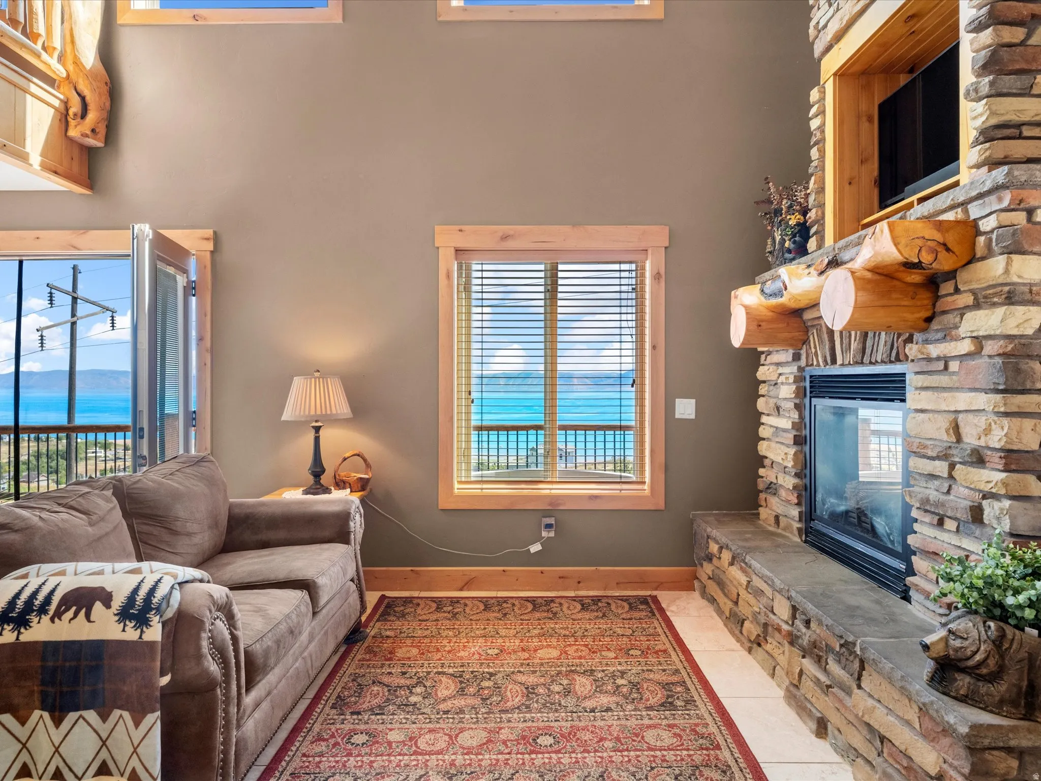 Stone-clad fireplace with a wood mantel