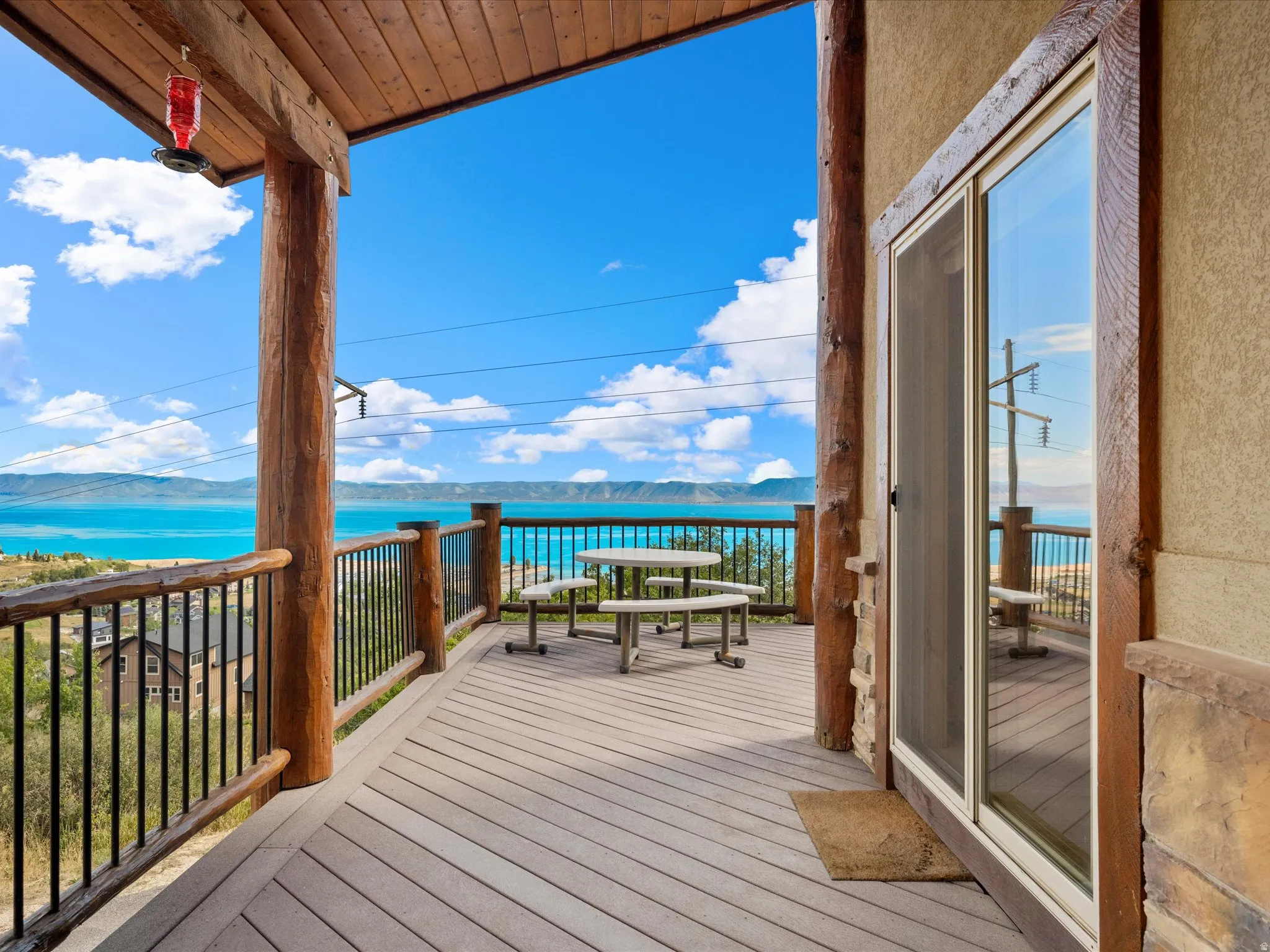 Expansive outdoor deck with natural wood structural posts and railing