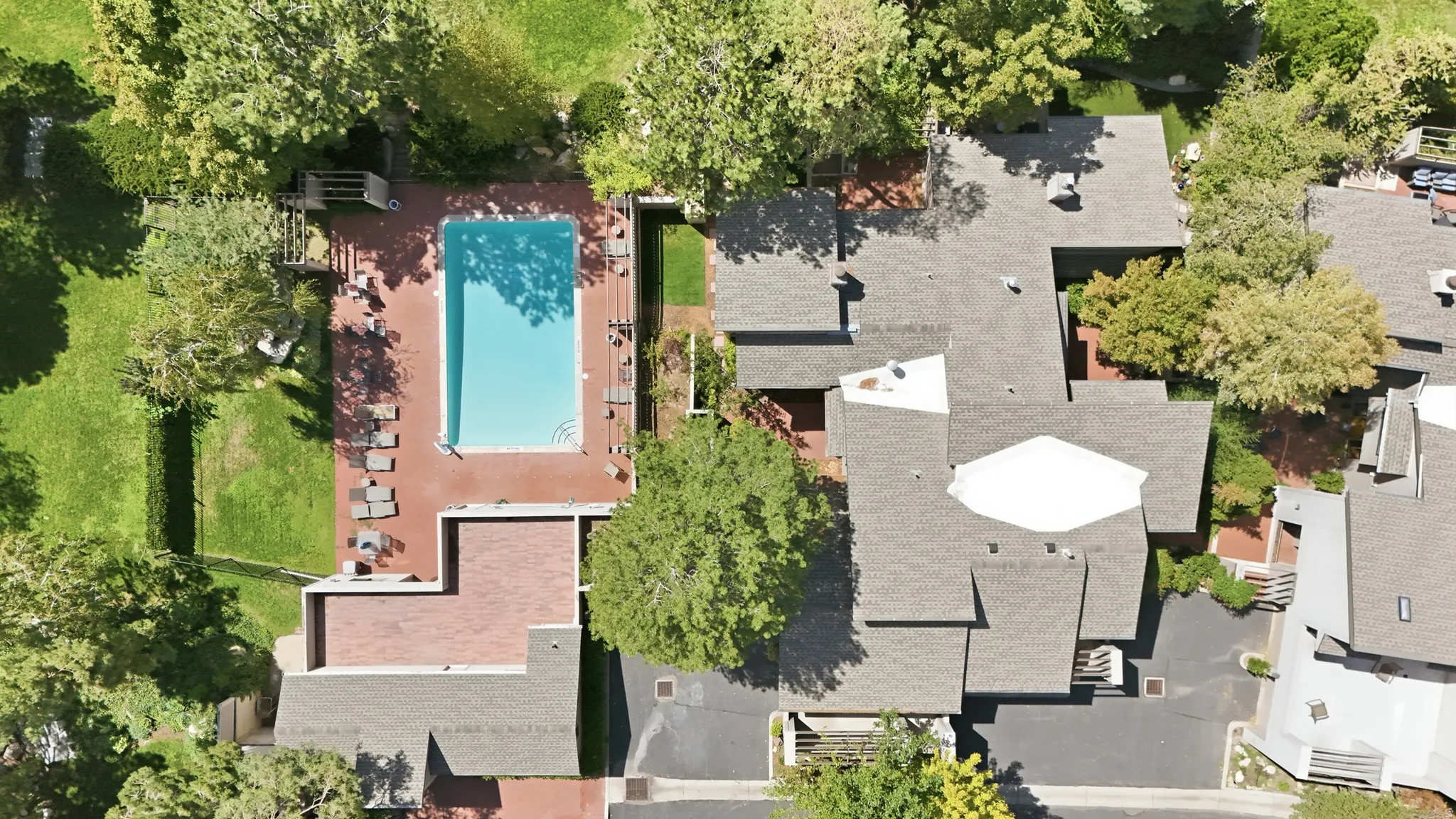 Swimming pool with surrounding brick decking