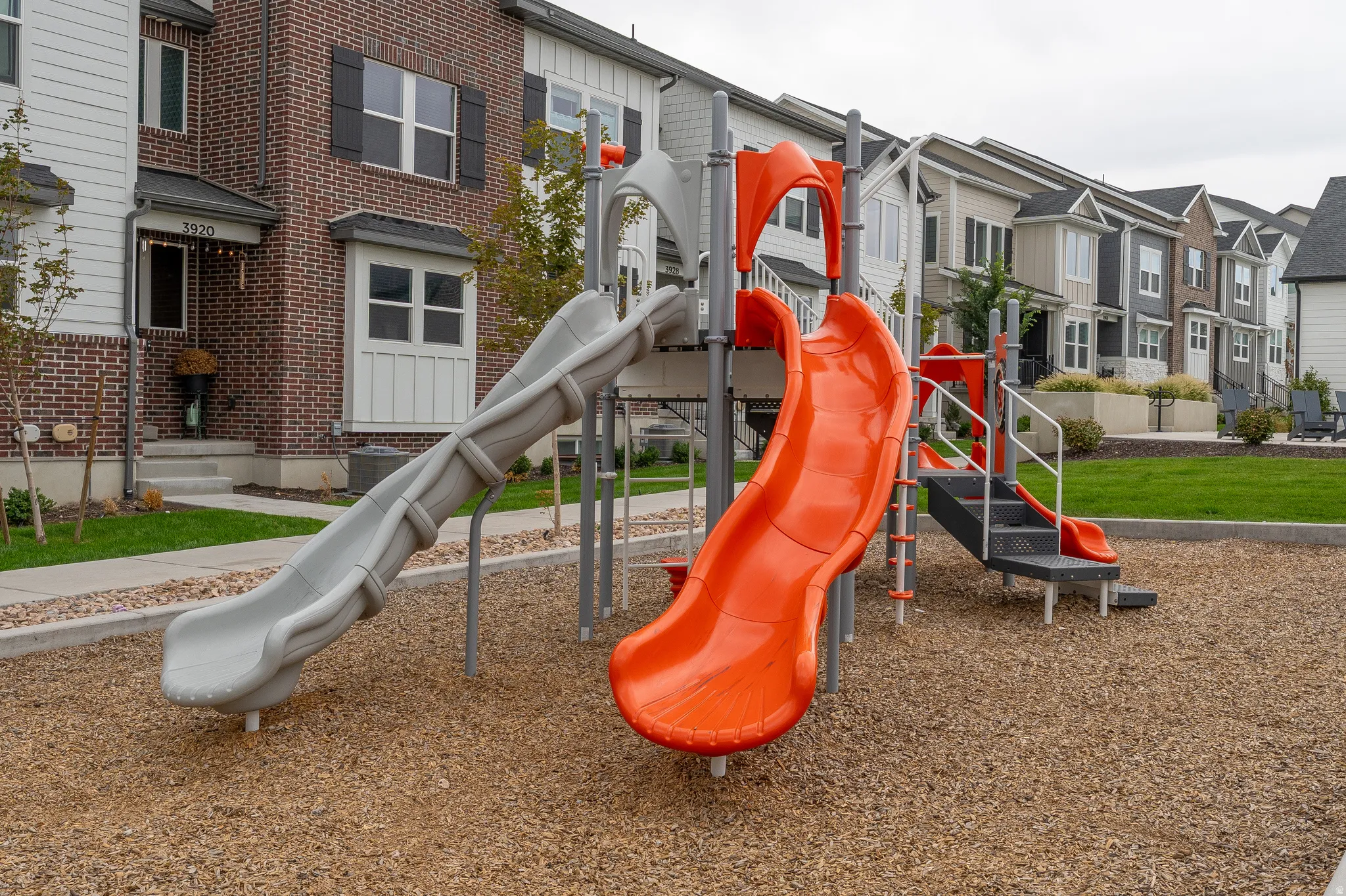 Community playground featuring multiple slides and climbing elements