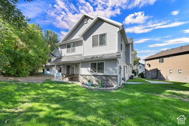 Two-story exterior with gray siding and stone accents is sure to make you sizzle.