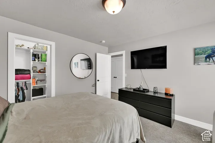 2nd Bedroom. Recessed closet with integrated shelving and hanging rods