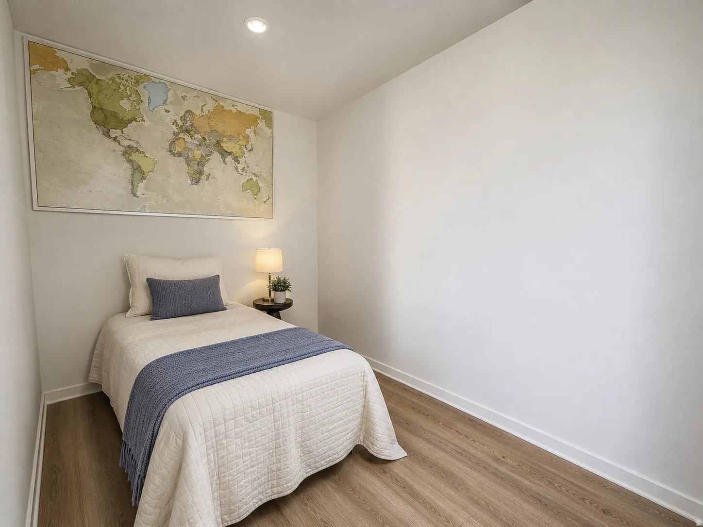 Listing photos have been digitally edited to remove personal belongings and reduce visual clutter. Bed and picture was added