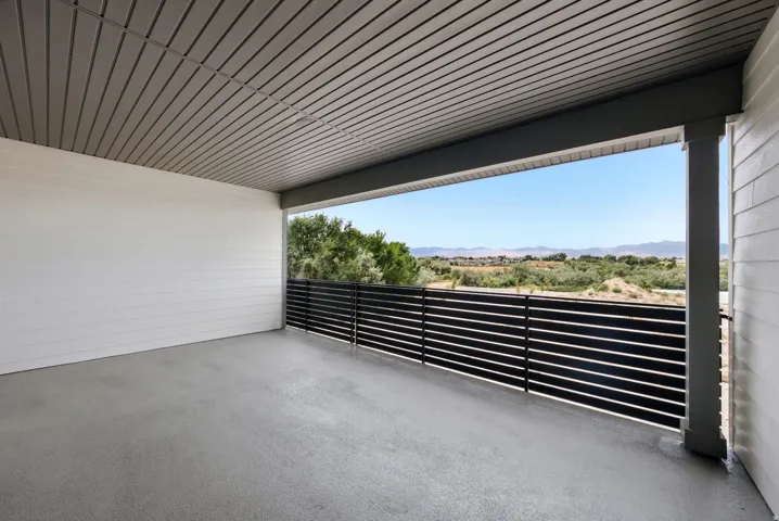 Covered outdoor patio with a flat concrete surface