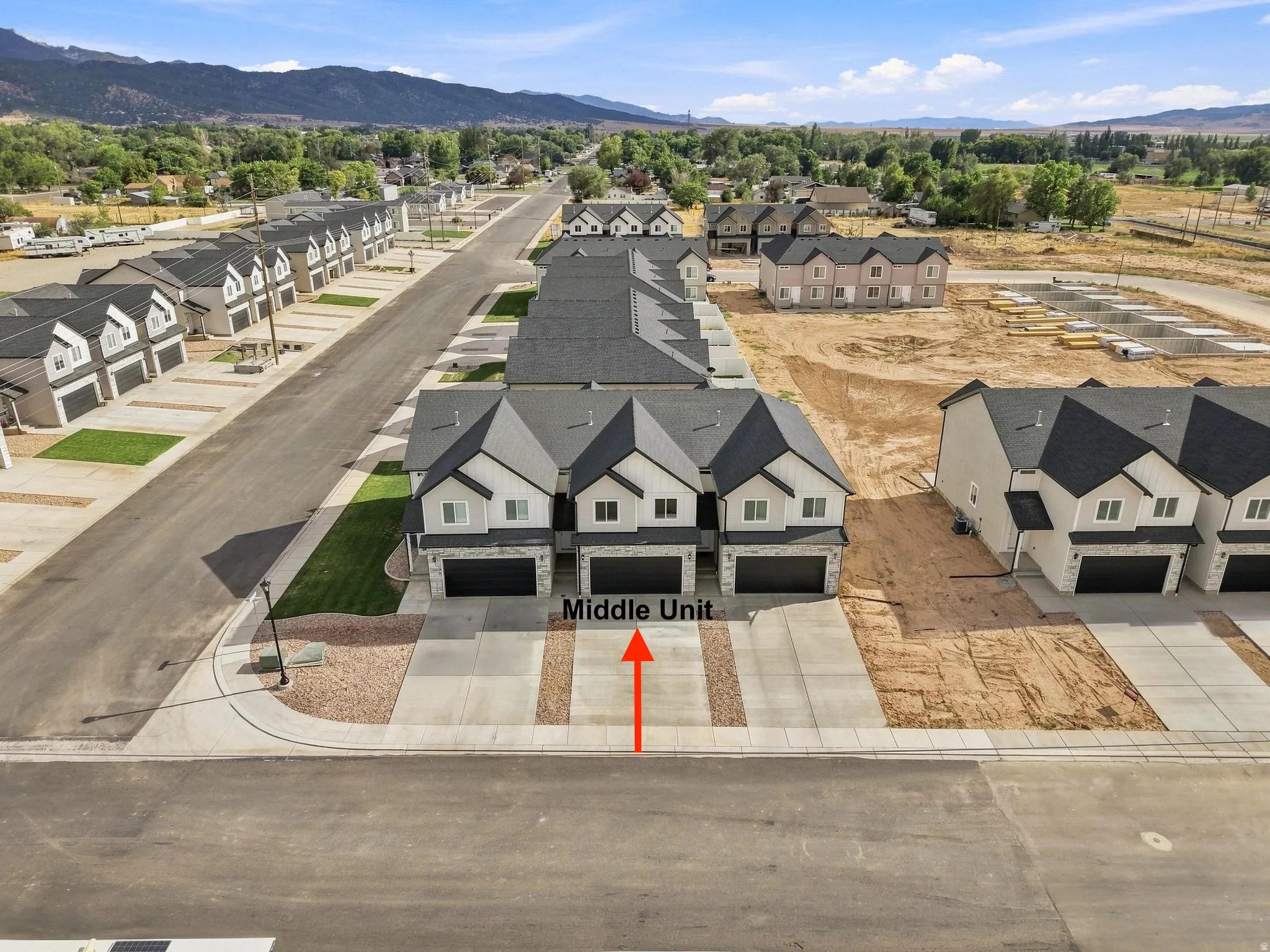 Contemporary townhome community featuring multi-story units with attached garages