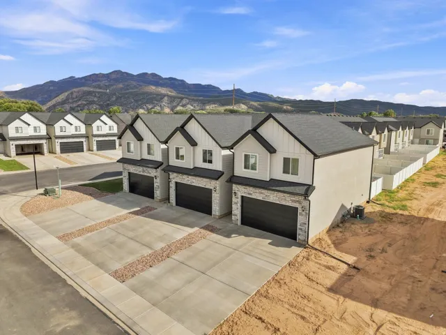 Contemporary facades featuring horizontal siding and stone accents