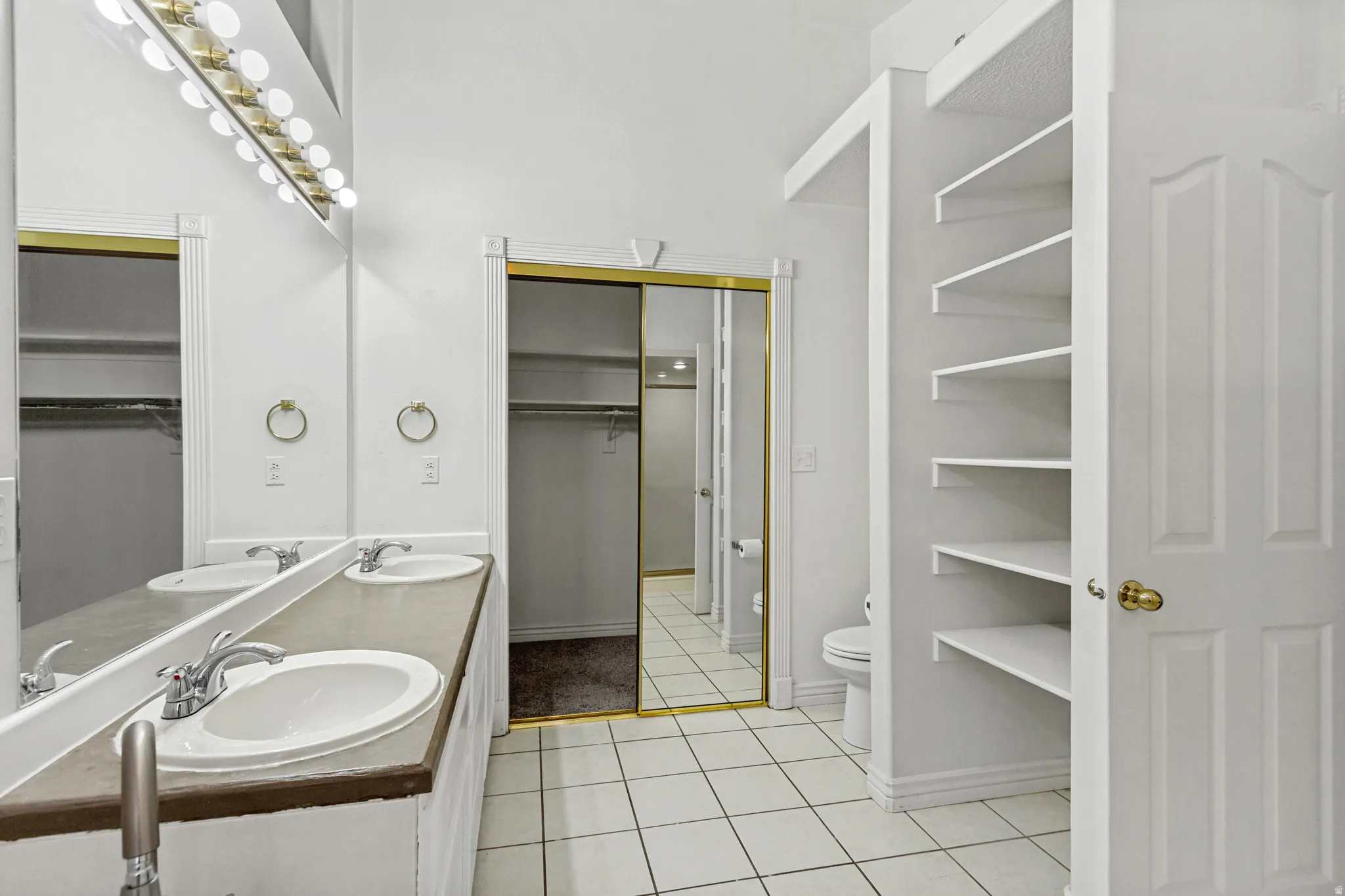 Dual vanity featuring individual sinks and chrome fixtures